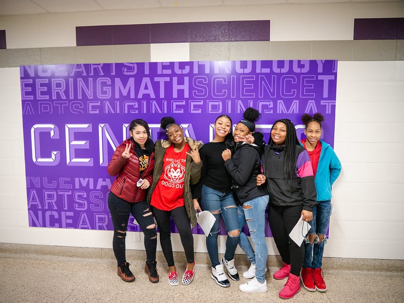 students standing in front of new Brooklyn Center brand